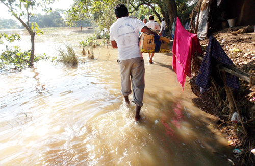 One of our volunteers is traveling with medicines to a flooded village to provide relief to the animals.)